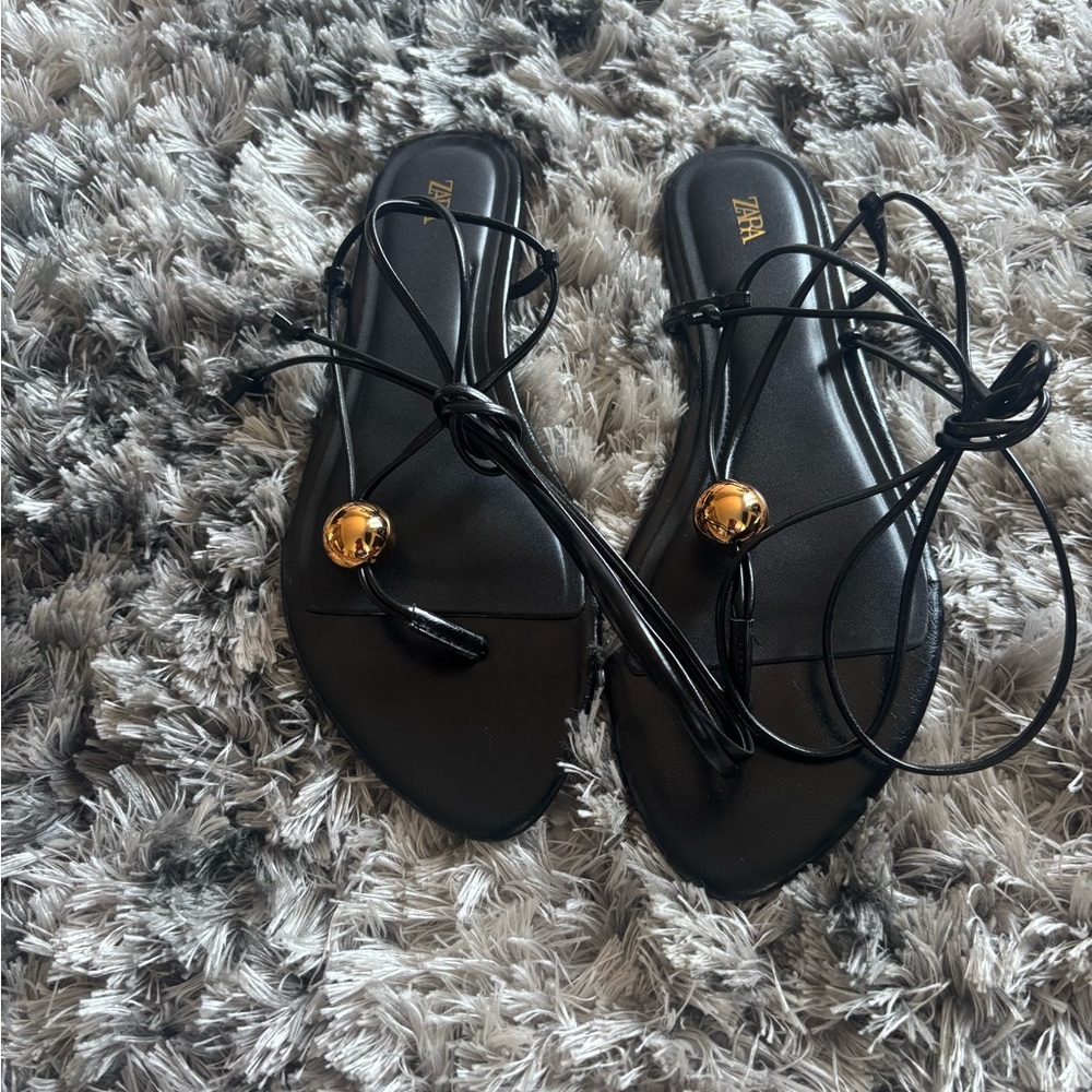 Zara Black Lace-Up Flat Sandals with Gold Orb Detail